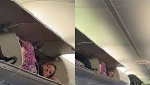 Viral Video Shows Woman Napping in Plane's Overhead Bin, Sparking Online Speculation