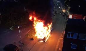 Riots Erupt in London: Bus Torched and Police Car Overturned
