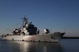 Italian Navy Ship Carries Migrants to Albanian Port Amid Legal Hurdles